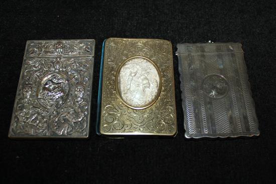 Edwardian silver card case, a mask & satyr-embossed plated case & a card case/aide memoire with framed hunting relief